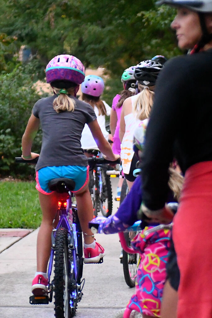 Bikers begin their glow-in-the-dark ride Saturday at Flat Branch Park in Columbia.